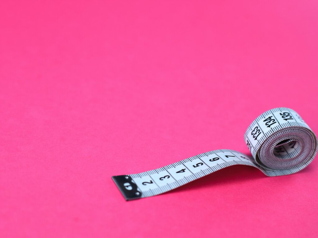 Measuring tape, representing tracking belly fat changes on GLP-1 medication