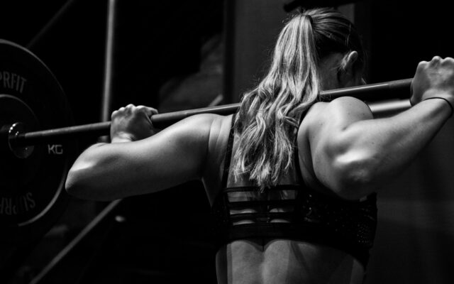 Woman doing strength training with a barbell